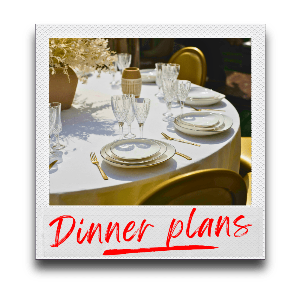 Polaroid photo of elegant banquet dinner table with white tablecloth, flatware, crystal glasses, white plates, and a vase of flowers captioned "Dinner plans" in red lipstick script lettering.